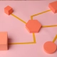 Formes géométriques reliées en réseau sur fond rose